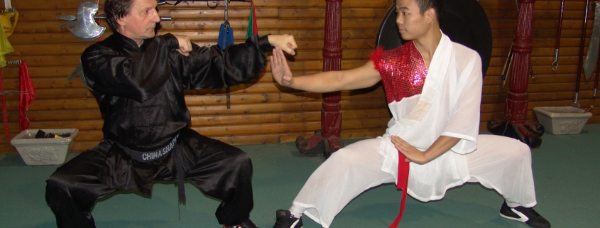GM Walter Toch with shaolin monk and workshop sanda fighting in his Academy.